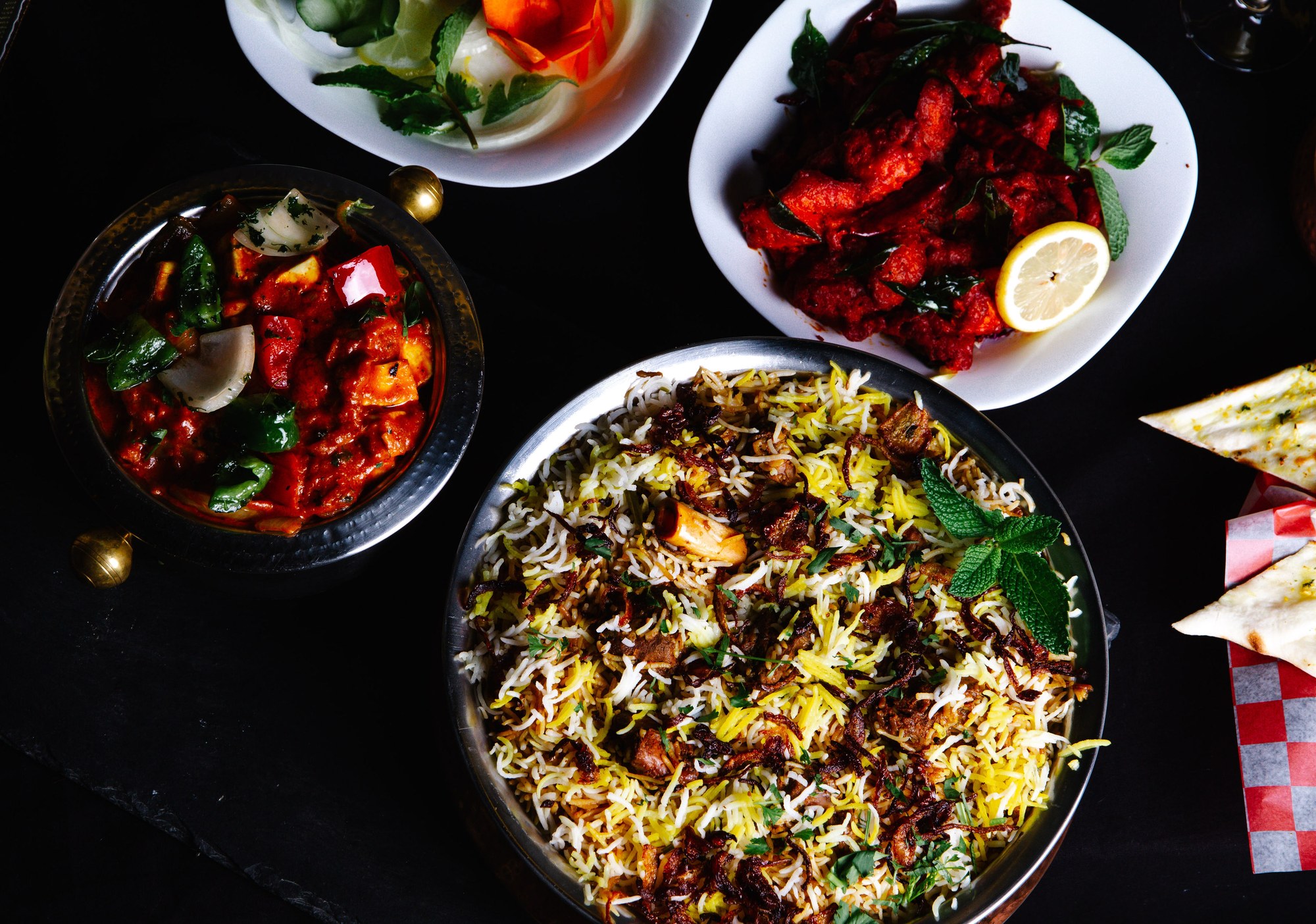 Hyderabad Biryani House signature spread - mutton biryani, paneer curry, chicken 65, naan