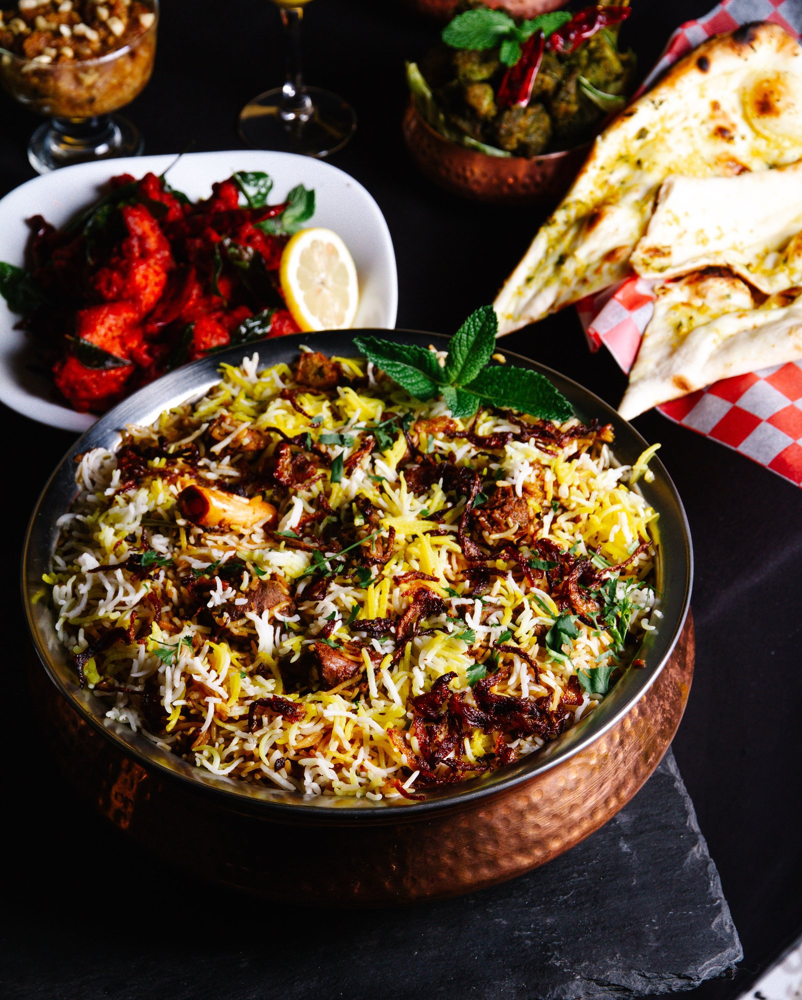 Hyderabad biryani spread with naan and chicken 65